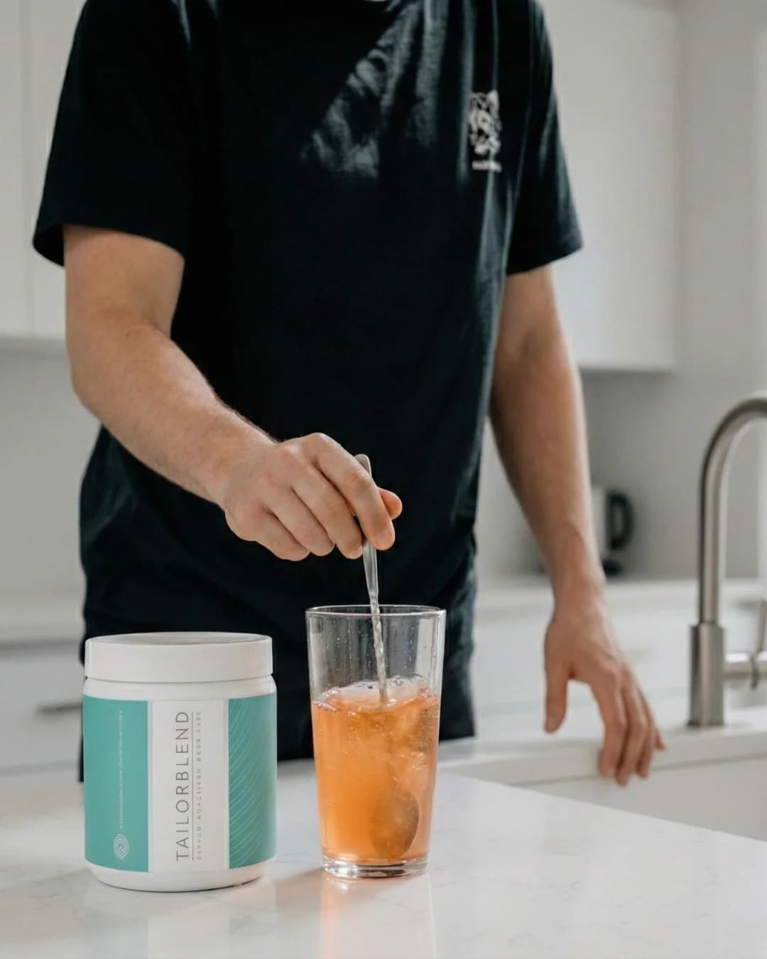 Man stirring TAILORBLEND drink
